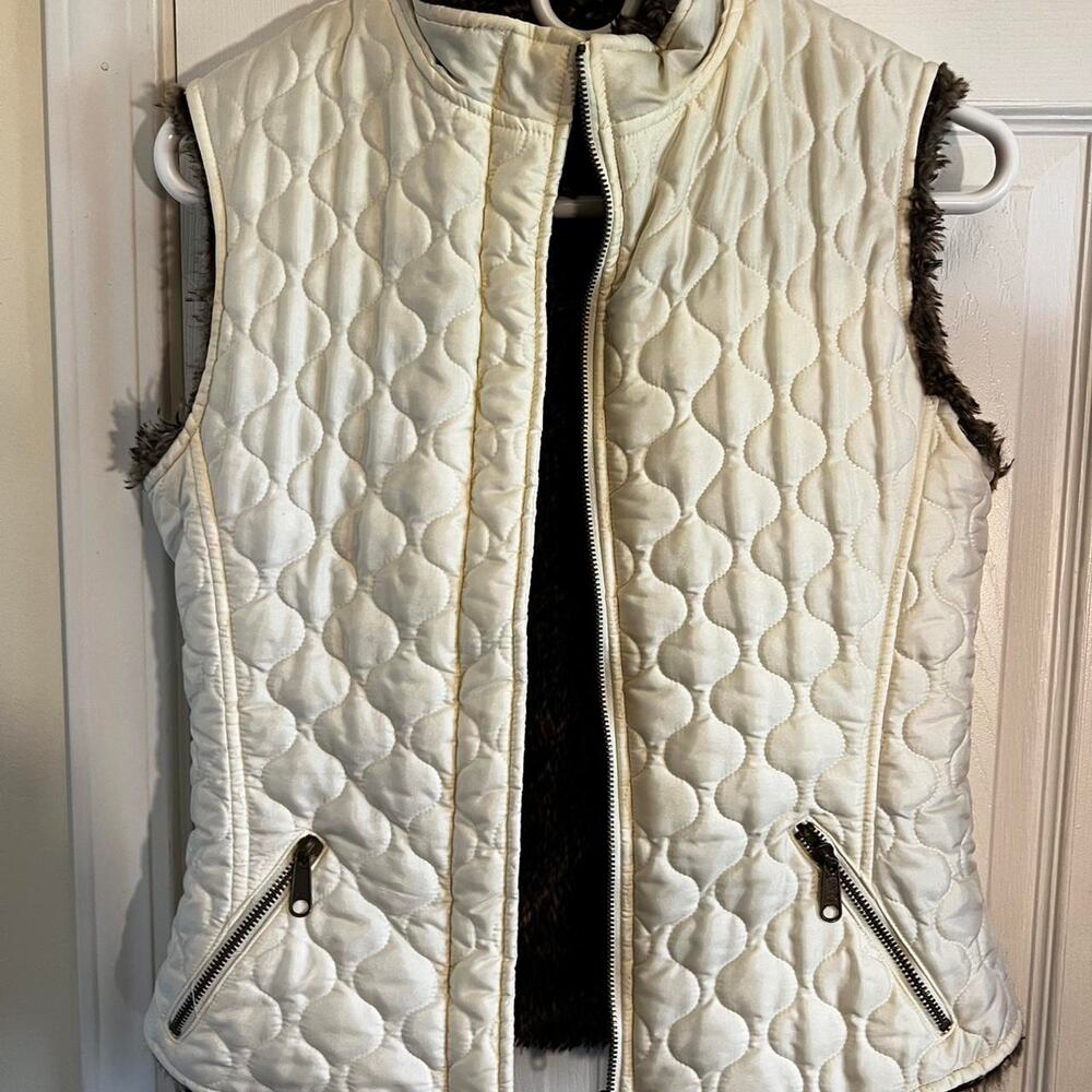 The limited cream quilted vest with faux fur lining